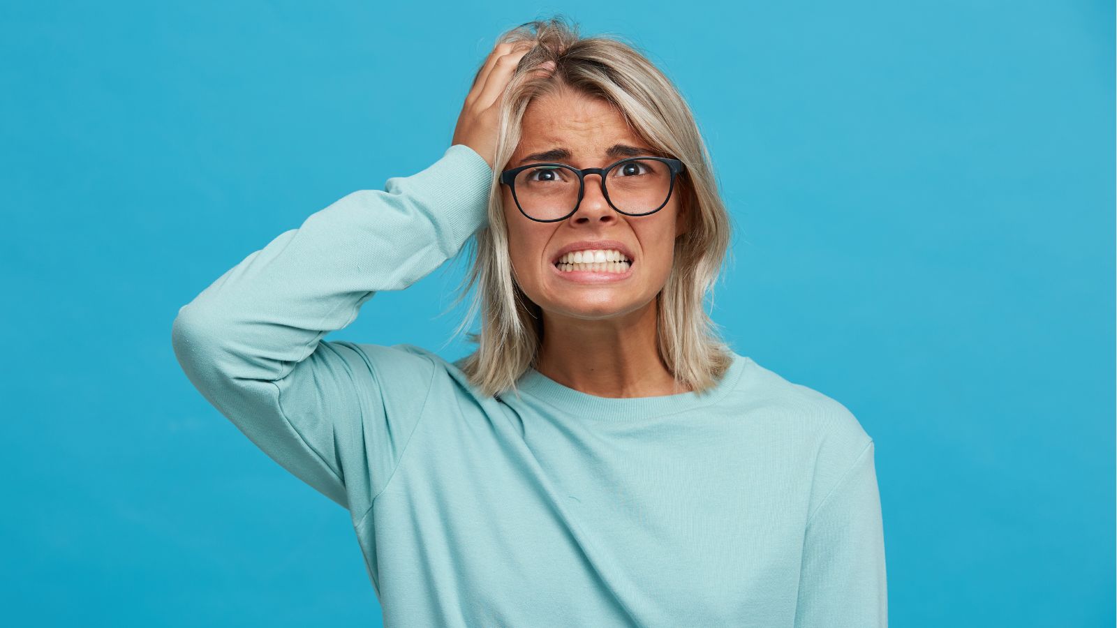 woman stressed out from hair loss